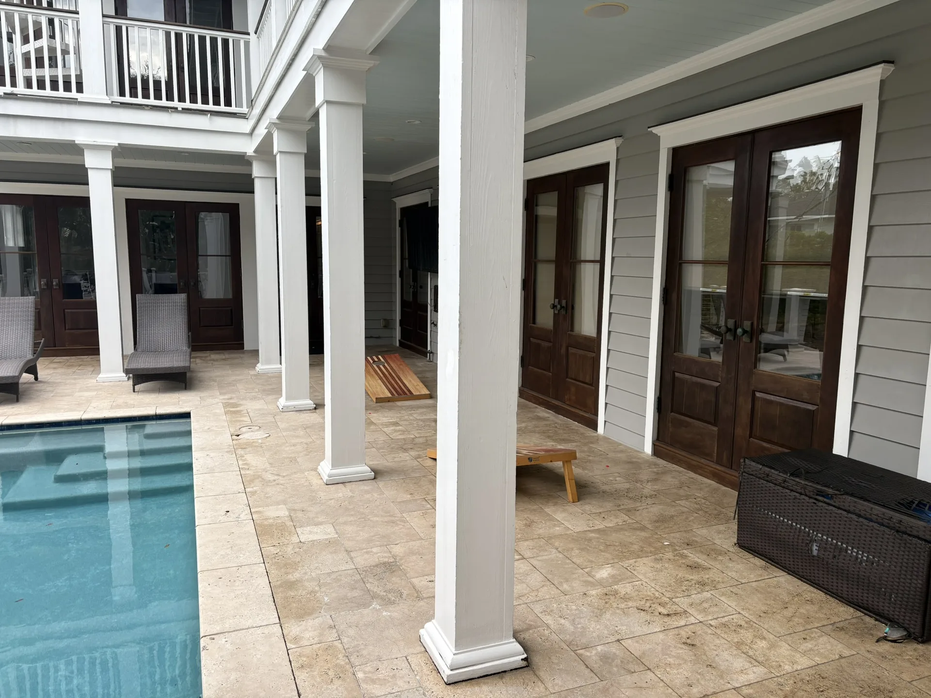 Private pool area with lounge chairs and tropical landscaping on Isle of Palms